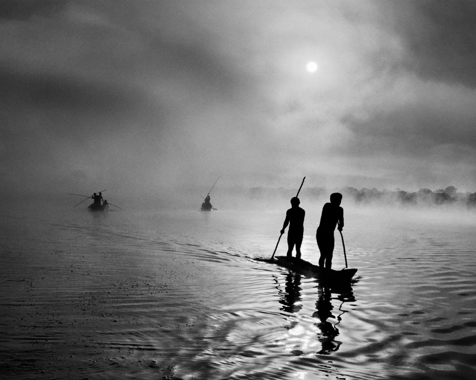 Fishermen on a misty river